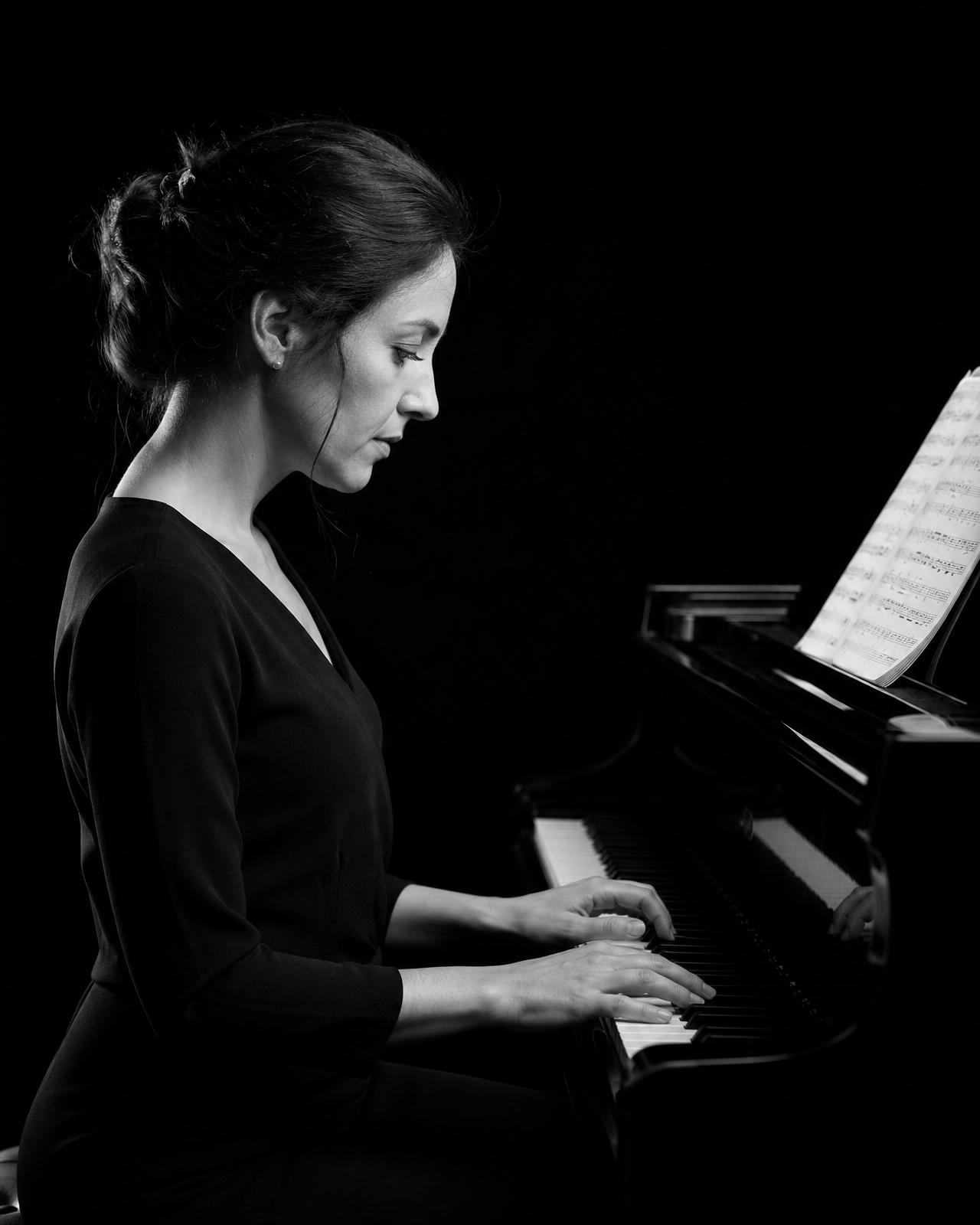 Adult learner playing piano